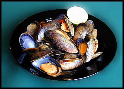A bowl of mouth-watering local mussels awaits ...